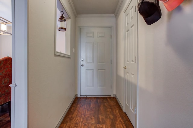 entryway featuring crown molding and dark hardwood / wood-style floors