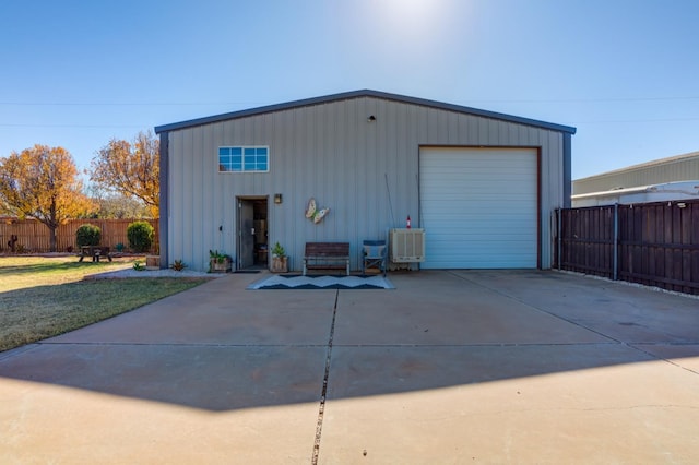 garage featuring a lawn