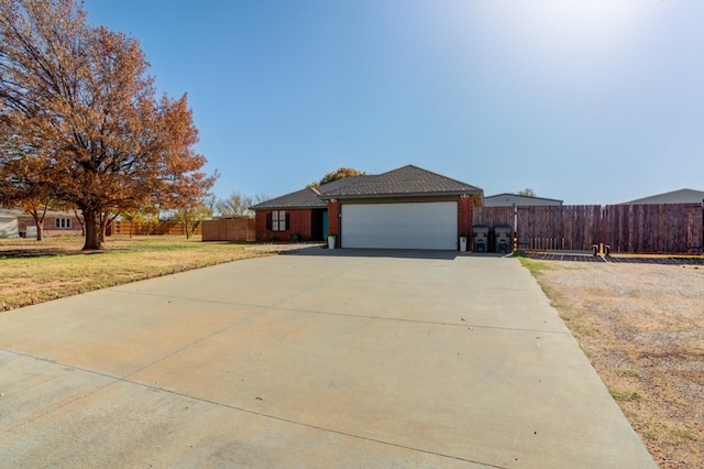 view of front of home with a garage and a front yard