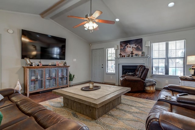 living room with dark wood-type flooring, ornamental molding, lofted ceiling with beams, and plenty of natural light