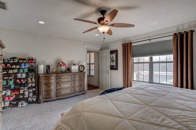 bedroom featuring ceiling fan and light colored carpet