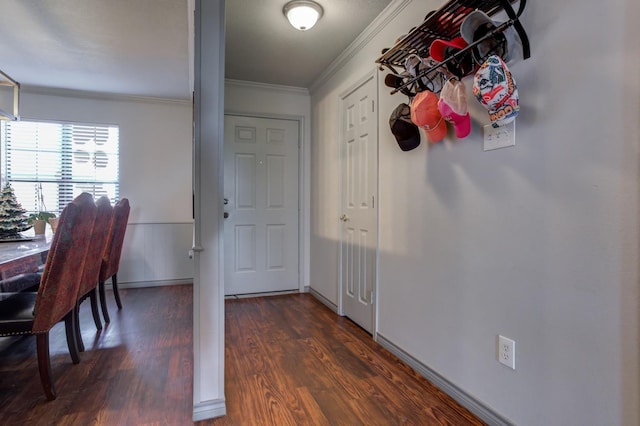 doorway with ornamental molding and dark wood-type flooring