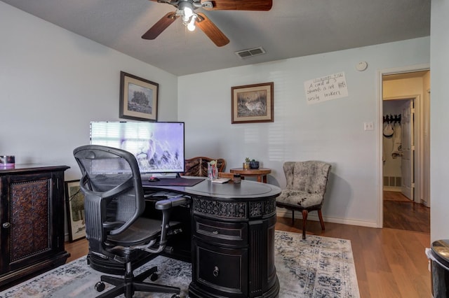 office featuring ceiling fan and light wood-type flooring