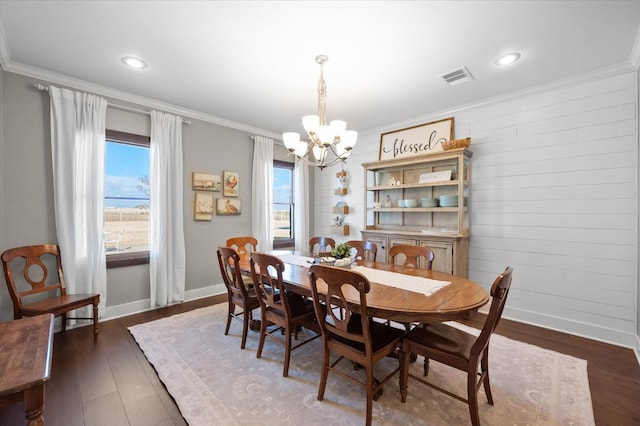 8405 E County Rd 6100, Idalou, TX 79329 - dining room featuring a chandelier, healthy amount of natural light, baseboards, ornamental molding, and dark wood-style flooring