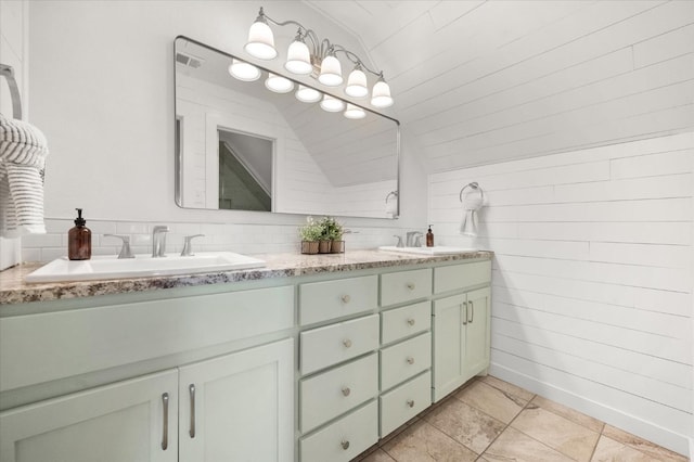 8405 E County Rd 6100, Idalou, TX 79329 - bathroom with vaulted ceiling, double vanity, and tile patterned flooring