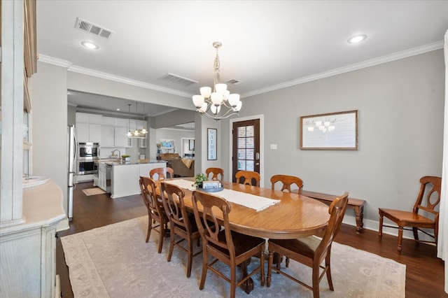 8405 E County Rd 6100, Idalou, TX 79329 - dining space with a chandelier, dark wood-style floors, ornamental molding, recessed lighting, and baseboards