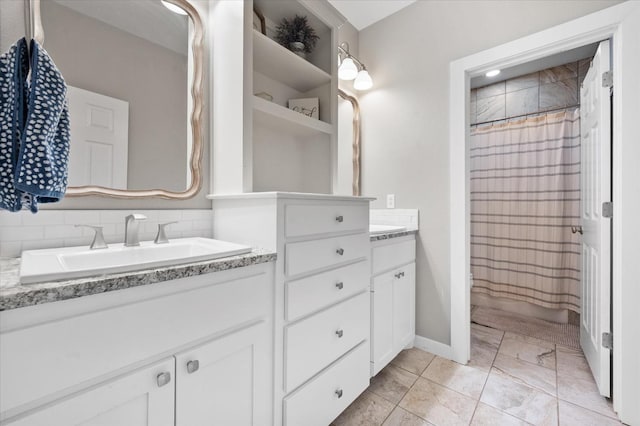 8405 E County Rd 6100, Idalou, TX 79329 - full bath with vanity, marble finish floors, curtained shower, and baseboards