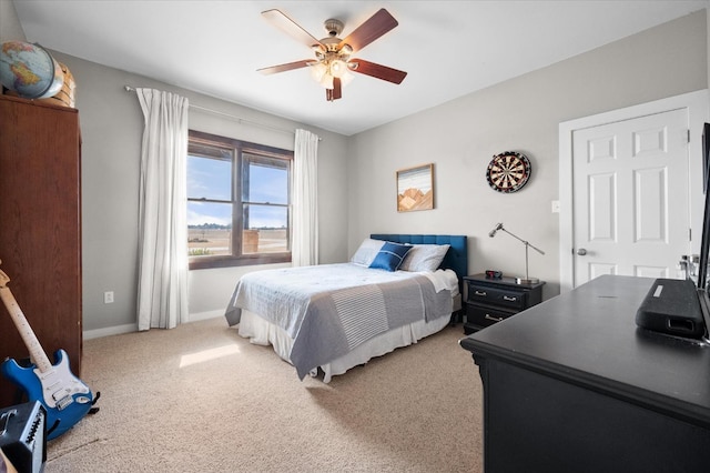 8405 E County Rd 6100, Idalou, TX 79329 - bedroom with light carpet, baseboards, and ceiling fan