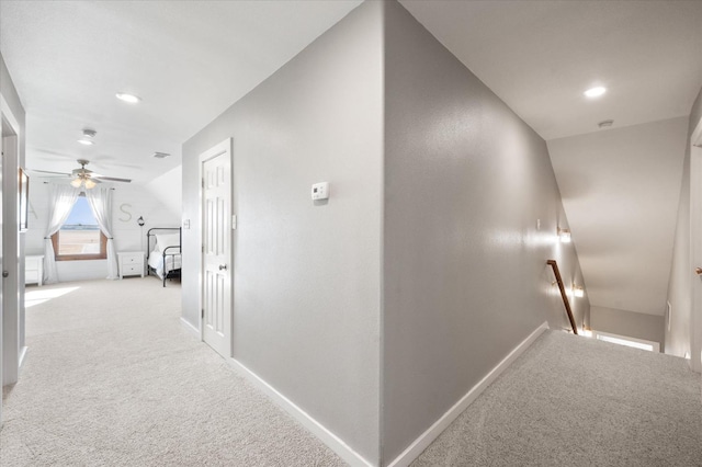 8405 E County Rd 6100, Idalou, TX 79329 - hall featuring an upstairs landing, light carpet, baseboards, and recessed lighting