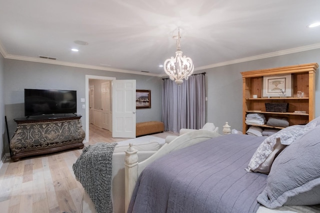 bedroom featuring crown molding, a notable chandelier, and light hardwood / wood-style floors