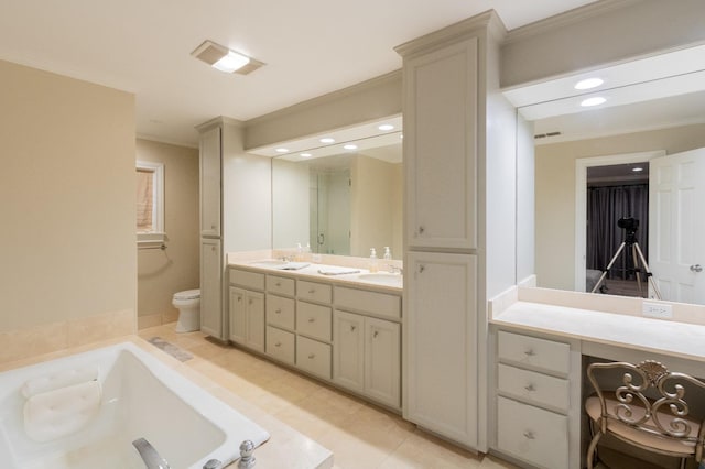 bathroom with tiled bath, tile patterned flooring, vanity, toilet, and crown molding