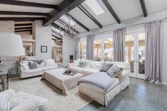 living room with an inviting chandelier, high vaulted ceiling, brick wall, french doors, and beamed ceiling