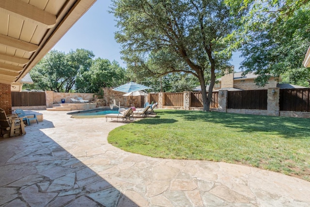 view of yard with a fenced in pool and a patio area