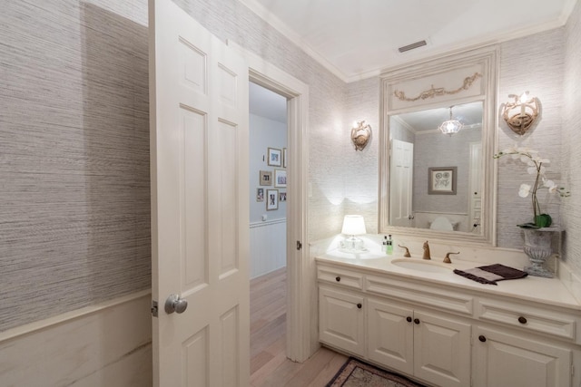 bathroom featuring vanity and crown molding