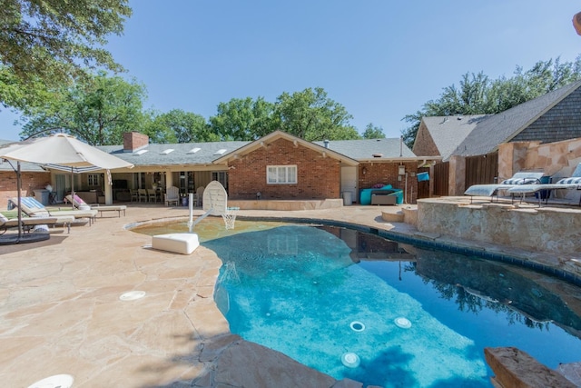 view of pool featuring a patio