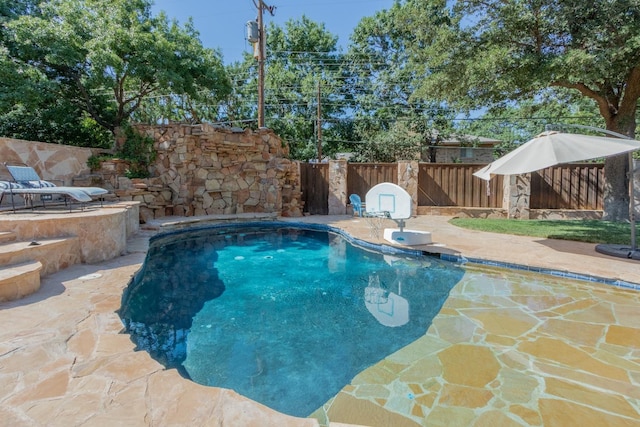 view of swimming pool featuring a patio