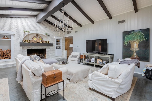 living room with dark hardwood / wood-style floors, a brick fireplace, vaulted ceiling with beams, and an inviting chandelier