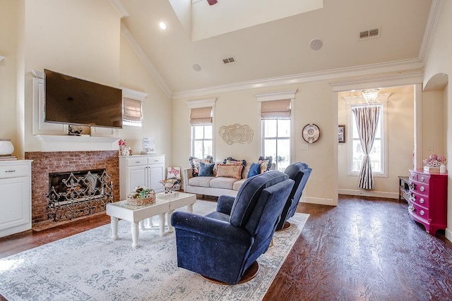 living room featuring high vaulted ceiling, ornamental molding, dark hardwood / wood-style floors, and a brick fireplace