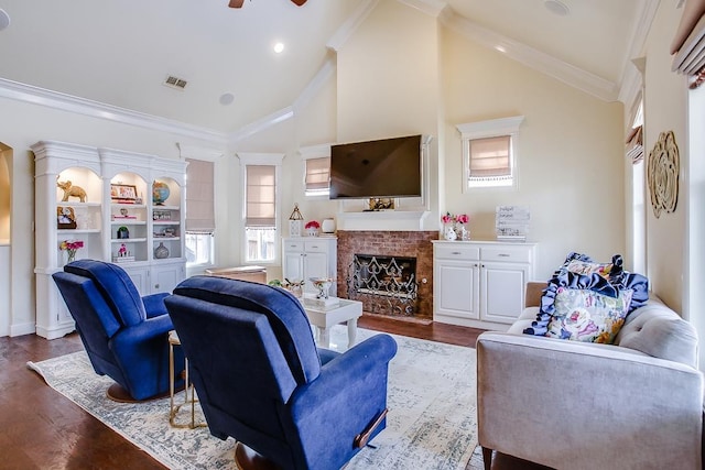 living room featuring ornamental molding, a brick fireplace, wood-type flooring, and high vaulted ceiling