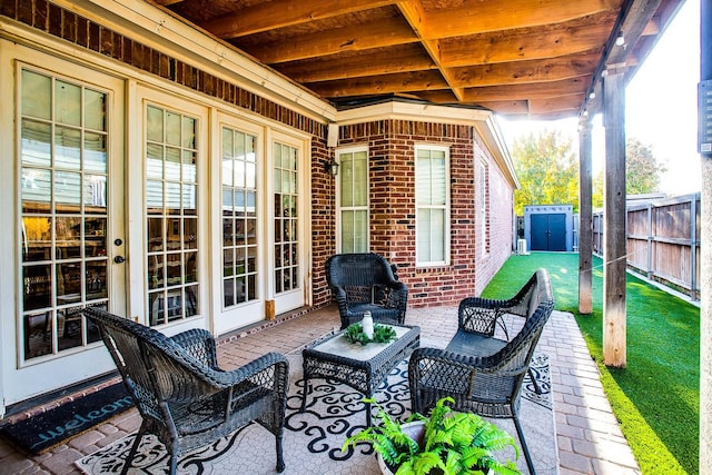 view of patio / terrace with a storage unit