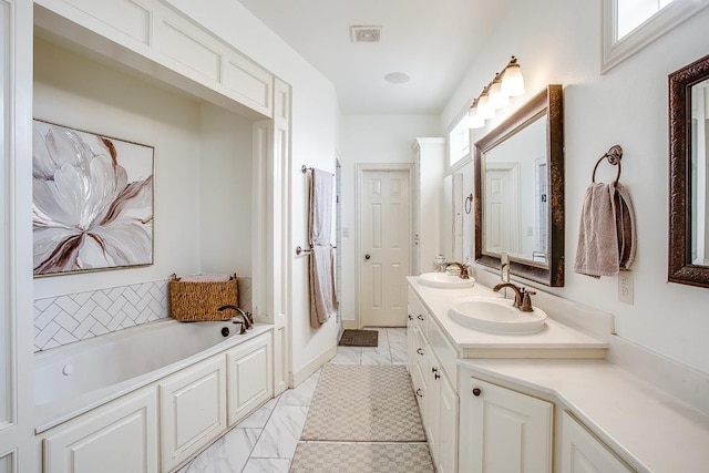 bathroom with vanity and a tub to relax in