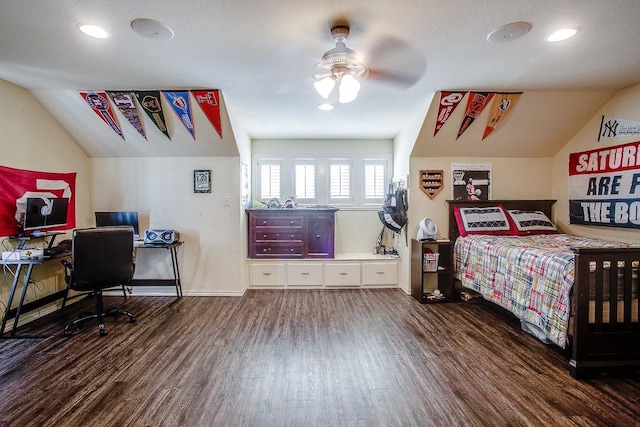 bedroom with vaulted ceiling, dark hardwood / wood-style floors, and ceiling fan