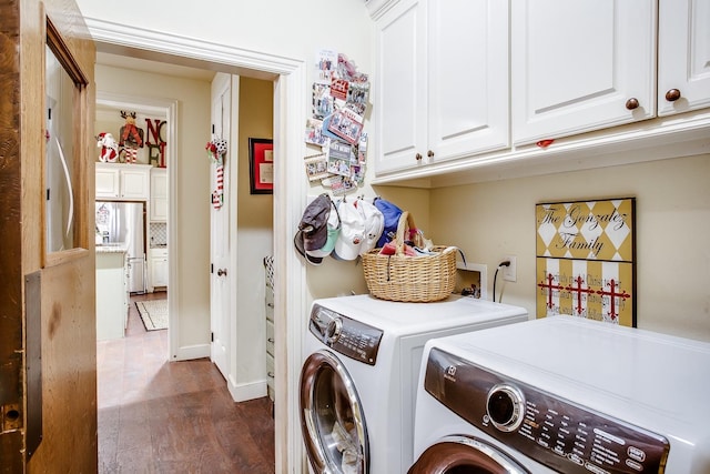 laundry area with cabinets, dark wood-type flooring, and independent washer and dryer