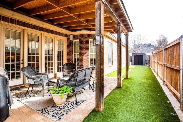 view of patio / terrace featuring a storage unit