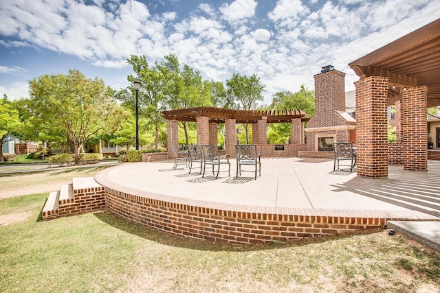 surrounding community featuring a patio area and a pergola