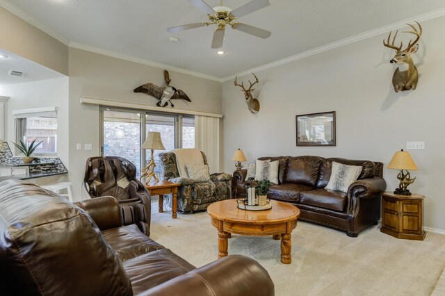 carpeted living room with crown molding and ceiling fan