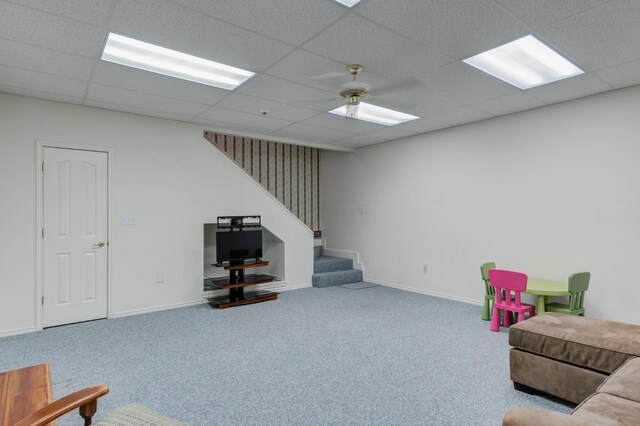 interior space featuring carpet floors, a paneled ceiling, and ceiling fan