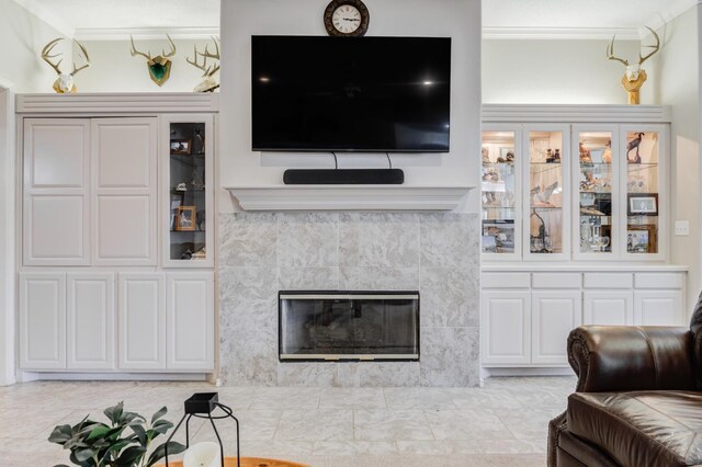 living room with a tile fireplace