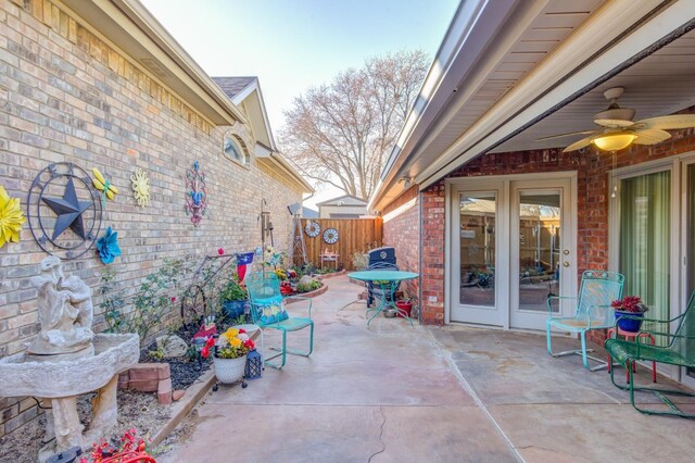 view of patio featuring ceiling fan