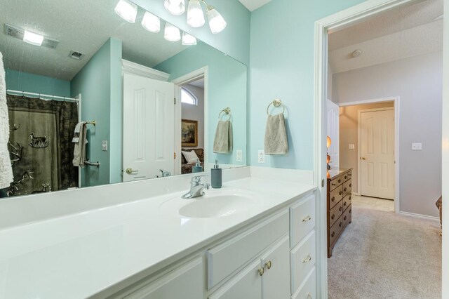 bathroom featuring vanity and a textured ceiling