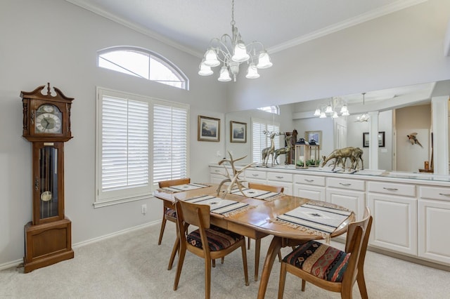 dining space with ornamental molding, a towering ceiling, light colored carpet, and a chandelier