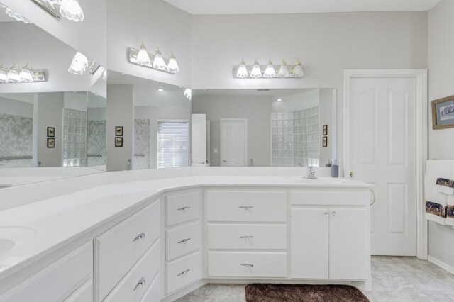 bathroom featuring vanity and a shower