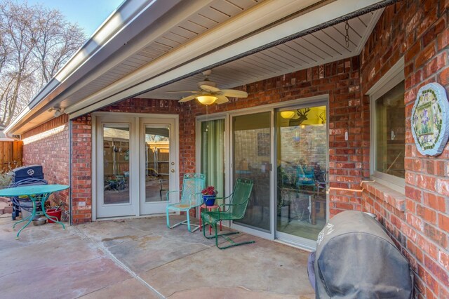 view of patio / terrace with french doors, ceiling fan, and a grill