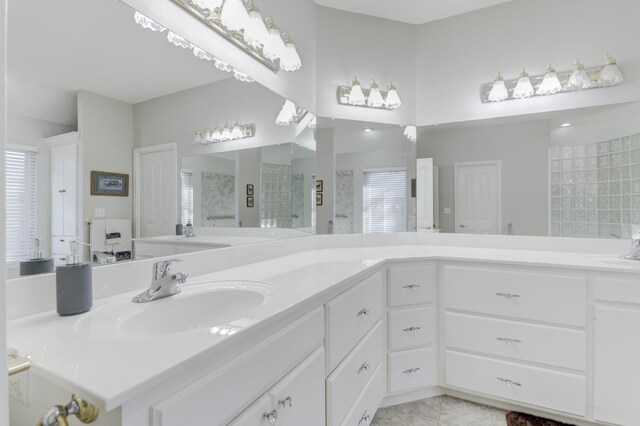 bathroom with vanity and walk in shower