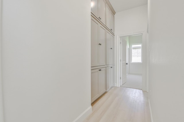 hallway with light wood-type flooring