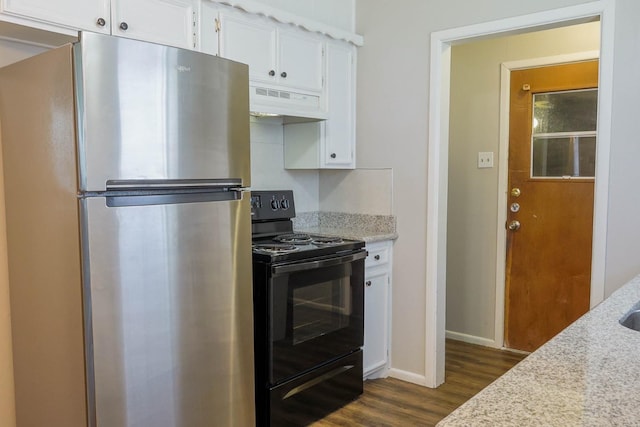 kitchen with light stone counters, stainless steel refrigerator, black / electric stove, dark hardwood / wood-style flooring, and white cabinets