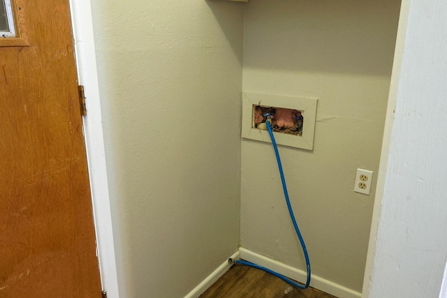 clothes washing area with hookup for a washing machine and dark hardwood / wood-style floors