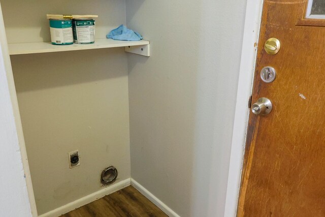 washroom featuring hardwood / wood-style flooring and electric dryer hookup