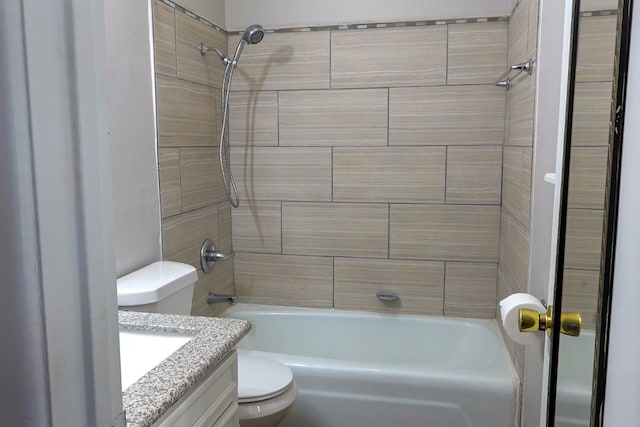 full bathroom with vanity, tiled shower / bath, and toilet