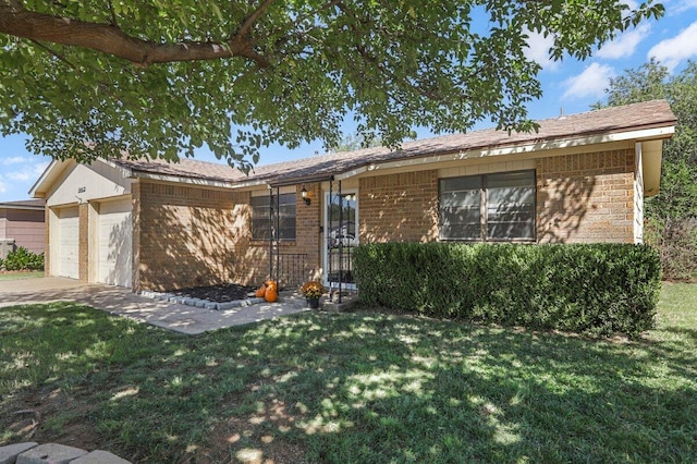 5408 22nd St, Lubbock, TX 79407 - ranch-style house featuring a front yard, a garage, and brick siding