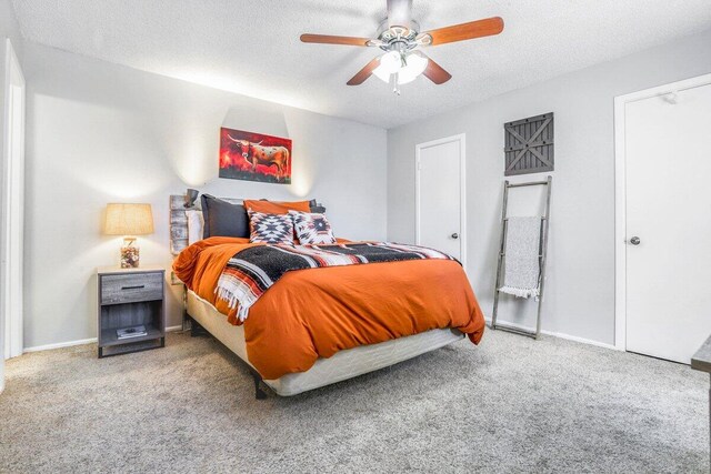 5408 22nd St, Lubbock, TX 79407 - carpeted bedroom with baseboards, a textured ceiling, and a ceiling fan