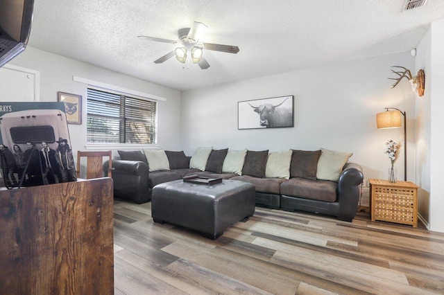 5408 22nd St, Lubbock, TX 79407 - living area with a ceiling fan, visible vents, a textured ceiling, and wood finished floors