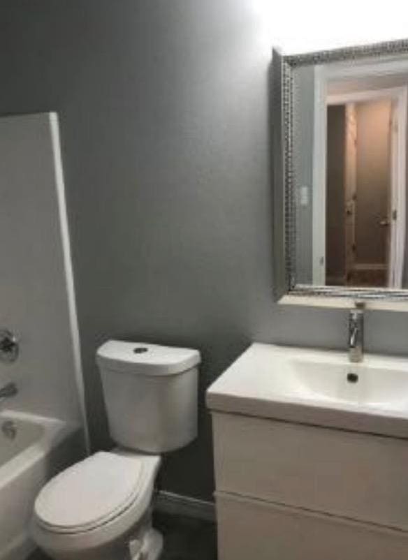 full bathroom featuring vanity, shower / bathing tub combination, and toilet