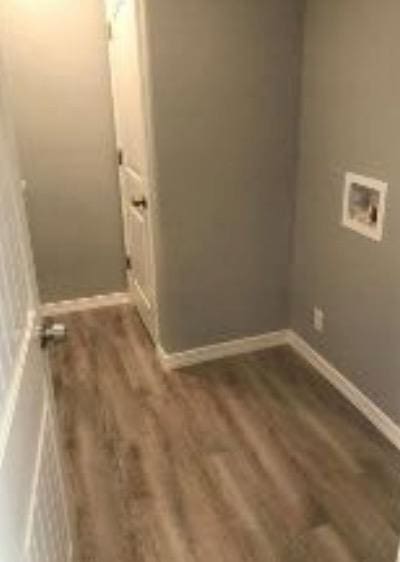 laundry room with hookup for a washing machine and dark wood-type flooring