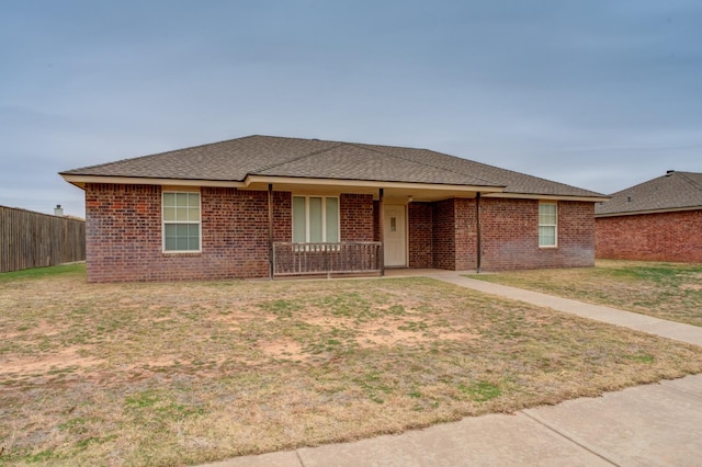 ranch-style house featuring a front yard