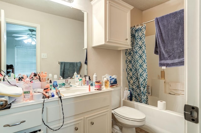 full bathroom featuring ceiling fan, shower / bath combo, vanity, a textured ceiling, and toilet